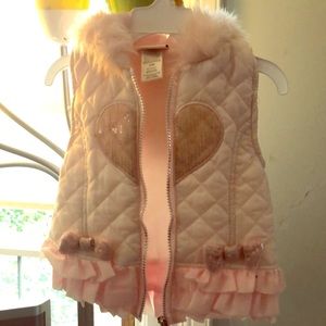 Pink winter vest.